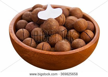 Delicious Macadamia Nuts On A Plate On A White Background