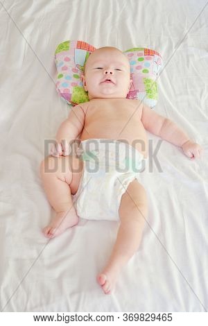 Newborn Baby Boy On The Orthopedic Pillow