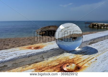 Crystal Glass Ball At The Beach/ Old Boat Reflection In The Glass Ball