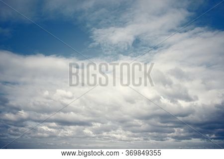 Tinted Dark Blue Sky And Clouds