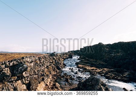 Mountain River From Ehsaraurfoss Falls, In Silfra Fault, Tingwedlir Valley.