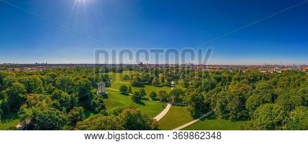 Beautiful View From An Drone Over Munich With Its Green Englischer Garten, A Park With Many Trees An