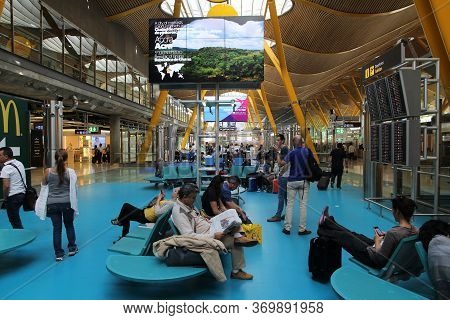 Madrid, Spain - October 20, 2014: Passengers Visit Terminal 4 Of Madrid Barajas Airport. The Famous 