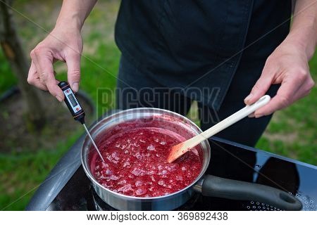 Chef Cooks Berry Puree For Making Marmalade. The Process Of Making Berry Jam.