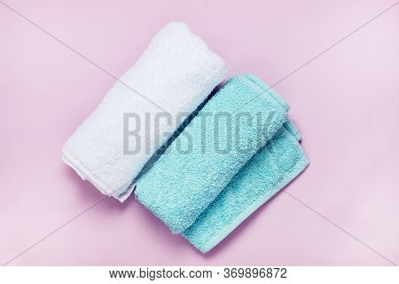Light Green And White Towels On Pink Background Top View Horizonta
