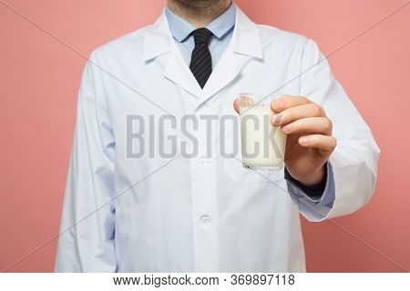 Doctor Holding Glass Of Milk Without Lactose
