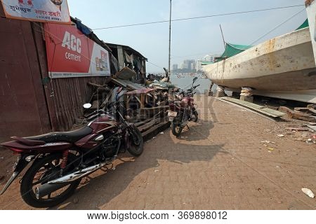 MUMBAI, INDIA - FEBRUARY 13, 2020: Motor cycle parked at Colaba Fishing Village, southern end of Mumbai city, India