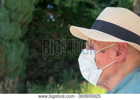 Elderly Man Wearing Face Mask As Coronavirus Protection,hampshire,united Kingdom.