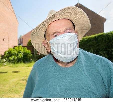 Elderly Man Wearing Face Mask As Coronavirus Protection,hampshire,united Kingdom.