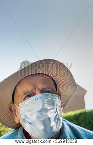 Elderly Man Wearing Face Mask As Coronavirus Protection,hampshire,united Kingdom.