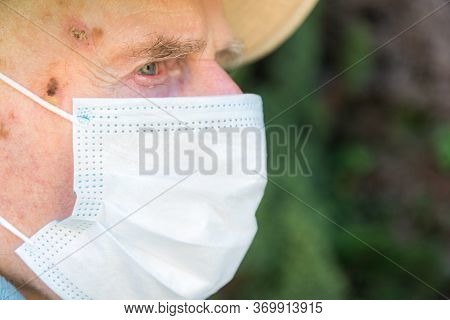 Elderly Man Wearing Face Mask As Coronavirus Protection,hampshire,united Kingdom.
