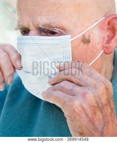 Elderly Man Wearing Face Mask As Coronavirus Protection,hampshire,united Kingdom.