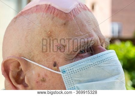 Elderly Man Wearing Face Mask As Coronavirus Protection,hampshire,united Kingdom.