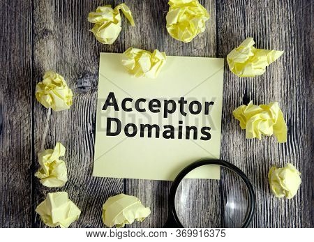 Acceptor Domain Seo Concept - Text On Yellow Note Sheets On A Dark Wooden Background With Crumpled S