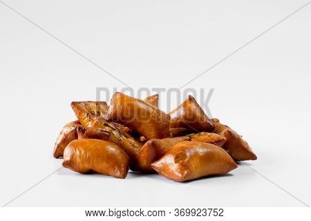 A Portion Of Unsalted Peanut Butter Pretzels On White Background