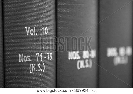 Selective Focus On Volume Ten Of Unidentified Hardbound Book Collection In Black And White