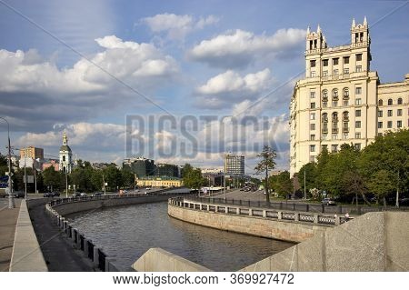 Moscow, Russia - 01 July 2020, Stalin's Skyscraper On Kotelnicheskaya Embankment On A Background Of 