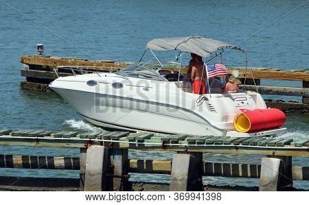 Upscale Motorboat Cruising On The Florida Intra-coastal Waterway Near Miami Beach.