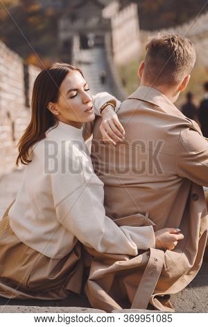 Beautiful Young Couple Showing Affection On The Great Wall Of China