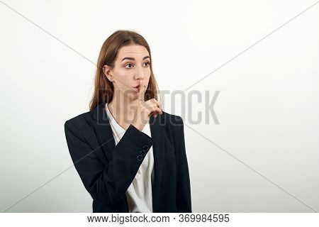 Index Finger On Lips, Silence Gesture, Shhh Quiet, Asks For Voicelessness Forefinger At The Mouth. Y
