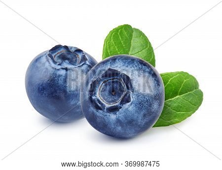 Two Blueberries With Blueberry Leaves Isolated On White. Macro Shutting Of Blueberry.