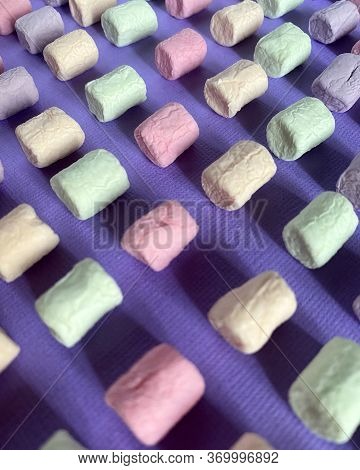 Marshmello On A Surface Of Different Colors