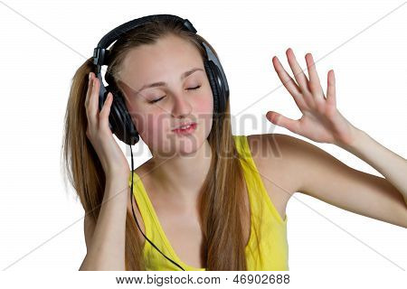 girl in headphones listens to music and laughs