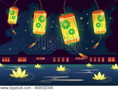 Bright Chinese Lanterns Glowing Above Water With Lotus Flowers At Night. Chinese Lantern Festival Ve