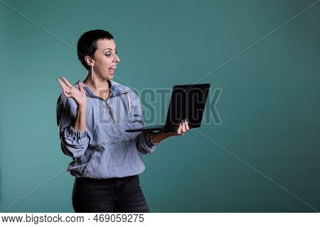 Smiling Woman Greeting Remote Team Discussing Business Strategy During Videocall Meeting Conference 