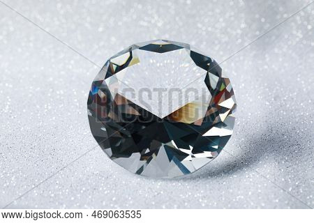 Beautiful Dazzling Diamond On Shiny Glitter Background, Closeup. Precious Gemstone