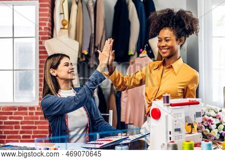 Portrait Of Young African American Woman And Young Girl Fashion Designer Stylish Sitting And Working