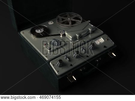 A Vintage Reel-to-reel Analogue Analogue Audio Recorder In A Leather Case On A Dark Moody Studio Bac