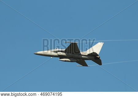 Nakhon Pathom, Thailand - January 14, 2023 : Military F16 Fighter Jet  Flying Through The Air Of Roy
