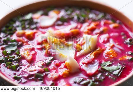 Cold Beetroot Soup With Boiled Eggs And Greenery. Traditional Summer Food.