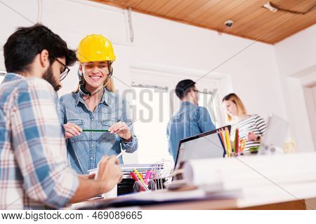 Office Full Of Hard Working Engineers Talking About Business.