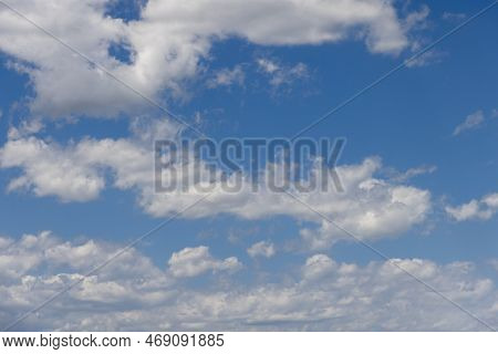 Summer Midday Pale Blue Sky With White Fluffy Lightest Clouds Torn Evenly Over It