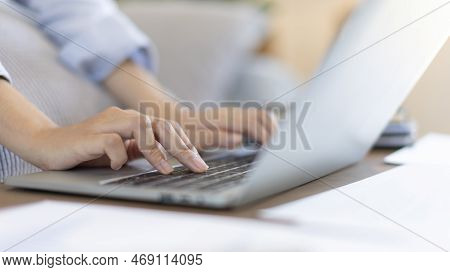 Close-up Shot Of Young Woman's Hand Pressing On Laptop Keyboard, Use Of Computers To Process Data Fo