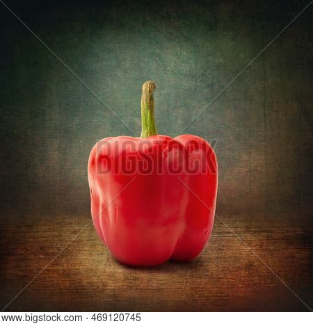 Red Bell Pepper. Red Pepper On A Dark Abstract Background. Grunge Textured Background. One Bell Pepp