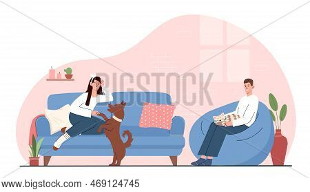 Daily Scenes With Pets. Man Sits On Pouffe With Cat On His Knees, And Woman Lies On Sofa And Holds D