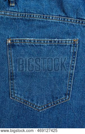 Back Side And Pockets Of Blue Jeans Pants Close-up. Denim Background, Texture, Wallpaper, Fashion Co