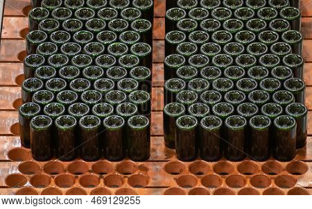 Production Of Cremant Sparkling Wine In Burgundy, France. Automatically Powered Bottling And Riddlin