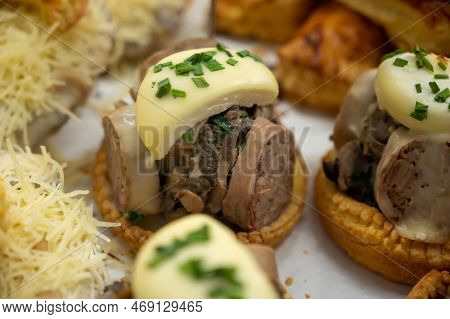 French Mini Quiche Pie With Goat Cheese And Traditional French Sausage Andouillette From Troyes In B