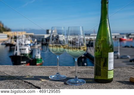 Tasting Of Txakoli Or Chacolí Slightly Sparkling Very Dry White Wine Produced In Spanish Basque Coun