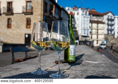 Tasting Of Txakoli Or Chacolí Slightly Sparkling Very Dry White Wine Produced In Spanish Basque Coun