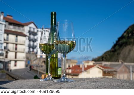 Tasting Of Txakoli Or Chacolí Slightly Sparkling Very Dry White Wine Produced In Spanish Basque Coun