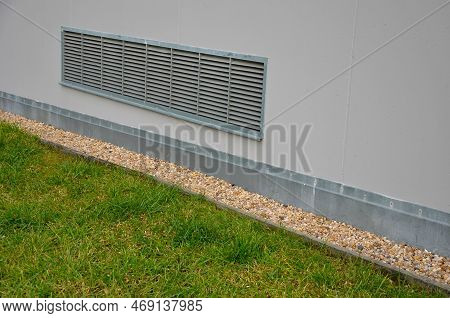 Ventilation Grille Along The House. Basement Windows Are Below Ground Level. Metal Walking Grid. Fou