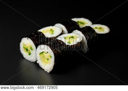 Kappa Maki Sushi Rolls With Cucumbers And Rice Wrapped In Nori On Dark Background