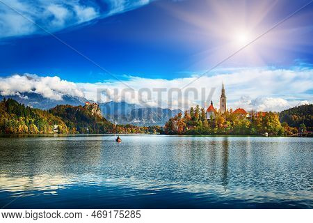 Church Of Assumption In Lake Bled, Slovenia With Blue Sky And Clouds In The Autumn