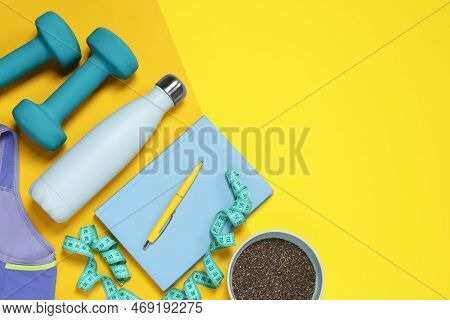 Weight Loss Concept. Flat Lay Composition With Notebook, Measuring Tape And Thermo Bottle On Color B