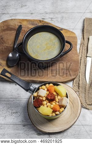 Cooked (cocido, Guiso) Stew, Chickpeas With Chorizo, Bacon, Carrot And Potato In Green Saucepan, Bla